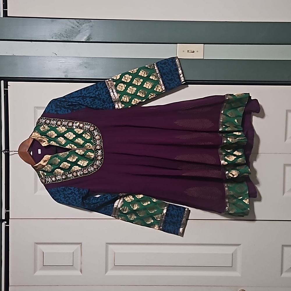 Beautiful ornate dress made in India, decorated beautifully with sequins.